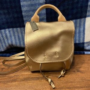 Coach small derby rose gold backpack